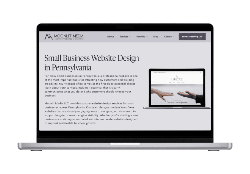 Laptop screen displaying the Moonlit Media homepage, featuring small business website design services and an embedded image of hands reaching toward each other, optimized to support local SEO and service area pages.