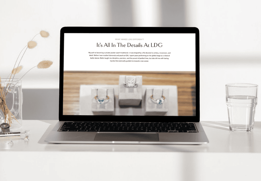A laptop screen displaying a jeweler’s website for small business SEO with the headline Its All In The Details At LDG above images of three rings on display pedestals.