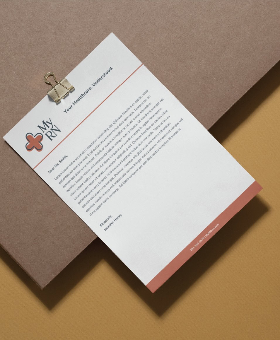 A letter on branded My RN stationery clipped to a clipboard, featuring the company logo and contact information at the bottom, showcasing custom stationery design.