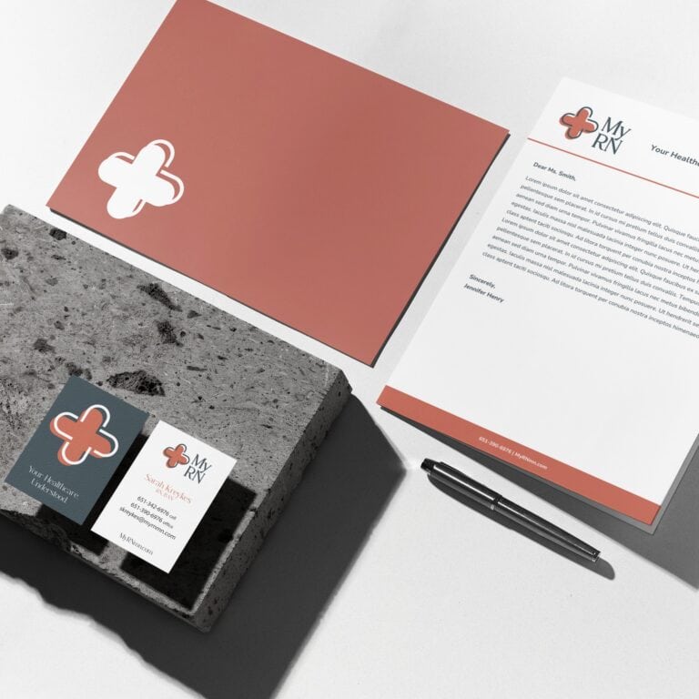 Branding materials for My RN, including a letterhead, business card, and pen, arranged on a concrete block for a Texas accountant.