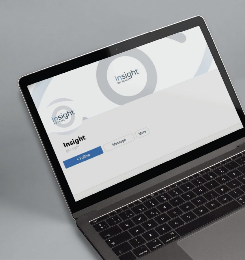 A laptop screen displaying the Insight 100 Years social media profile, showcasing effective nonprofit marketing.