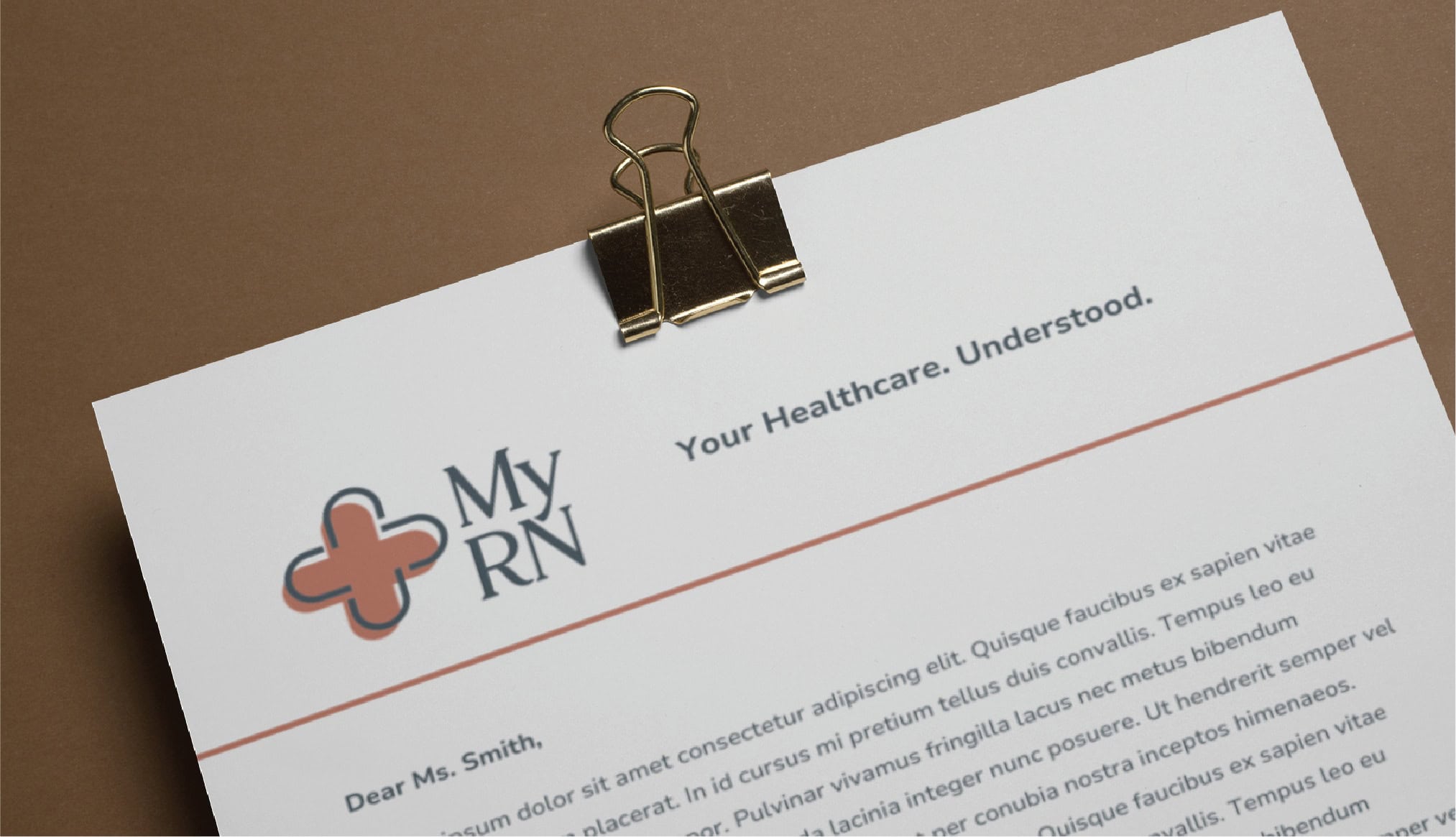 A stationery design featuring the MyRN logo, the slogan Your Healthcare. Understood., and placeholder text, secured with a gold binder clip.