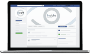 A laptop screen displaying a social media profile page for the California nonprofit Insight 100 Years, featuring a branded eye-shaped logo.