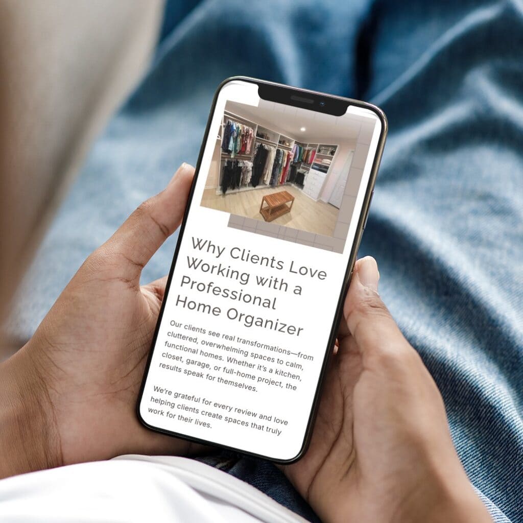 Hands holding a smartphone displaying a blog post about why clients love working with a professional home organizer, with website design by a Virginia agency visible above a photo of a walk-in closet.