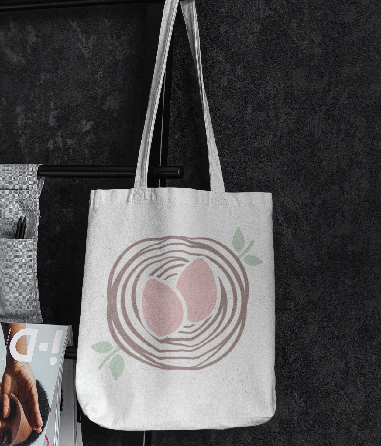 Off-white canvas tote bag featuring a graphic illustration of two pink eggs in a brown nest with small green leaves, designed for a Florida sleep consultant.