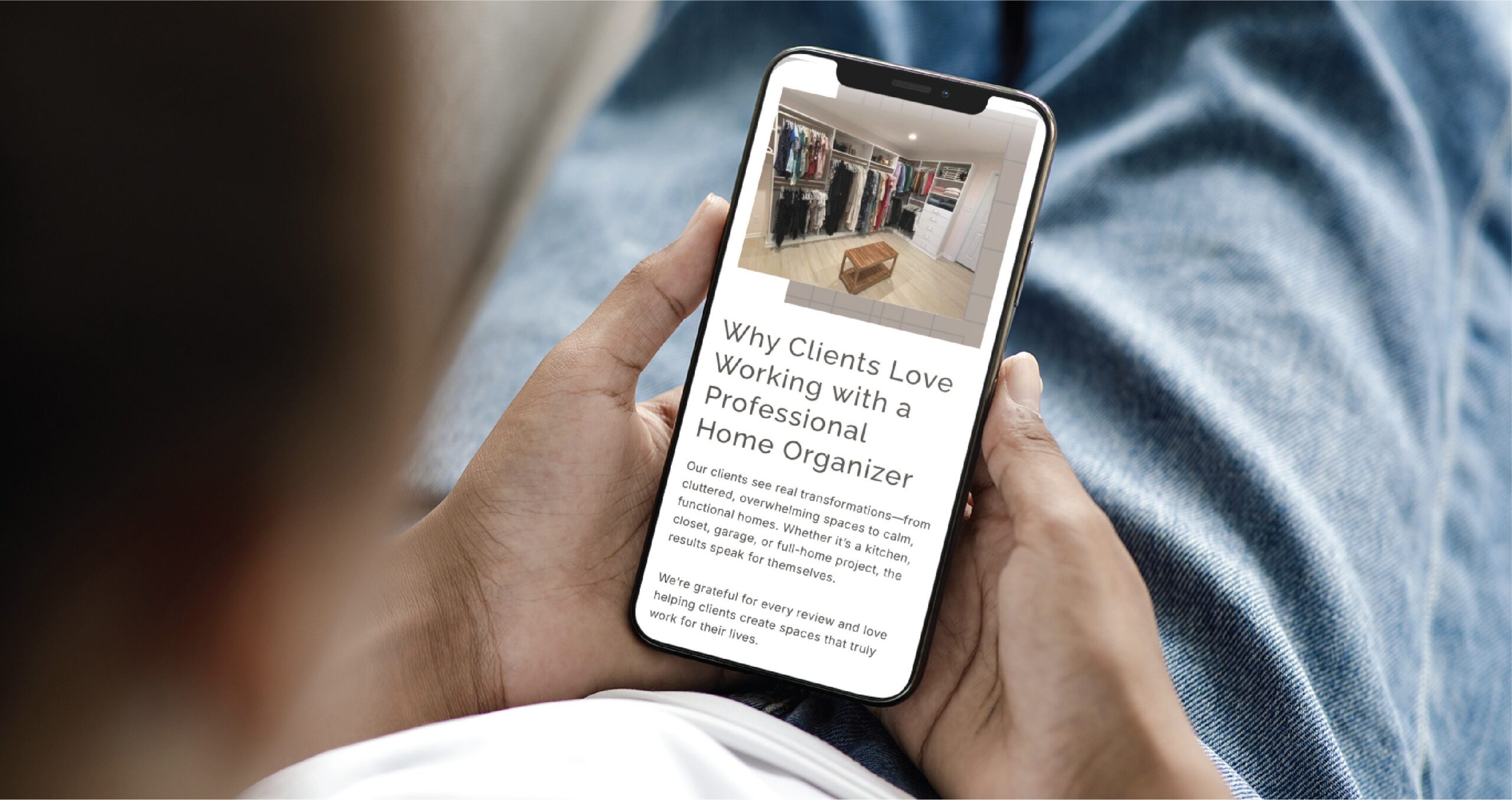 A person holds a smartphone displaying a blog post about Virginia home organizers titled Why Clients Love Working with a Professional Home Organizer, which includes an image of an organized walk-in closet.